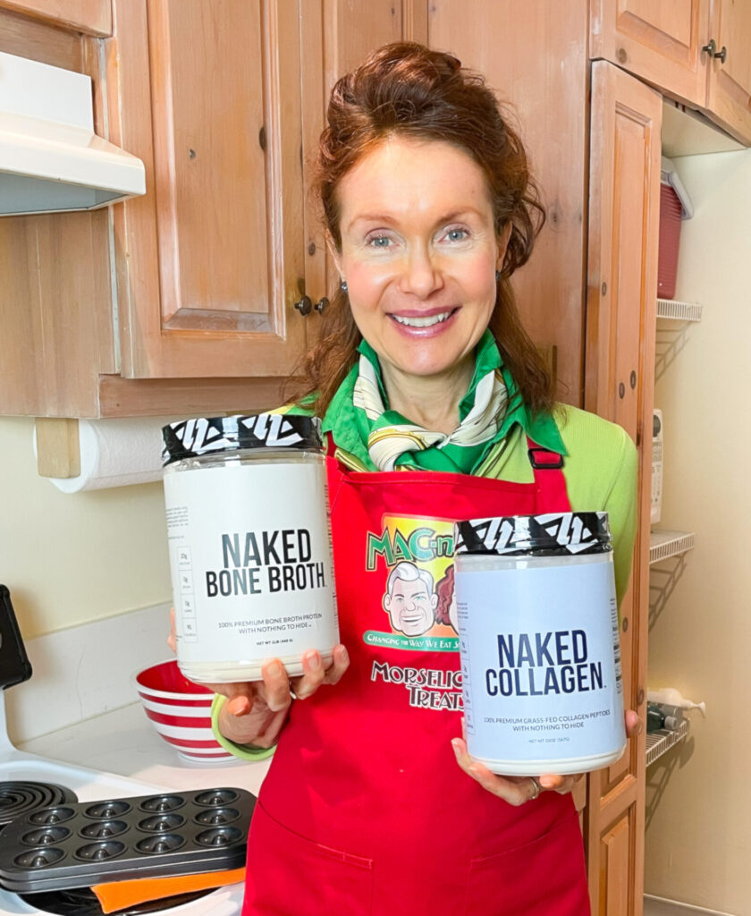 Mo in her red apron holding Naked Collagen's Bone Broth Protein in her right hand and Naked Collagen's Collagen in her left hand.